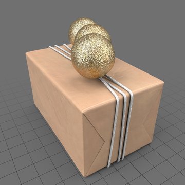 Wrapped present with gold balls