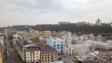 Fototapeta premium KIEV, UKRAINE - April 19, 2018: people and outdoor market on Kontraktova Square in Kiev city in spring.