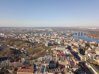 Fototapeta na wymiar Panoramic view of Kiev, Podol district, Vozdvizhenka and Bald mountain aerial view.