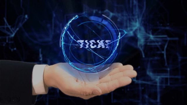 Painted hand shows concept hologram E-ticket on his hand. Drawn man in business suit with future technology screen and modern cosmic background