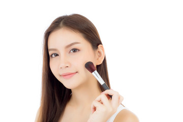 Beauty asian woman applying make up with brush of cheek isolated on white background, beautiful of girl holding blusher, skincare and cosmetic concept.