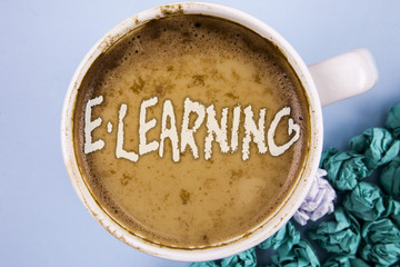 Conceptual hand writing showing E-Learning. Business photo showcasing Introduction of an electronic education in modern schools written on Coffee in Cup on plain background Paper Balls.