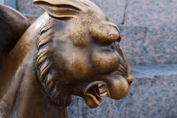Fototapeta na wymiar Bronze sculpture of Griffin on the University Embankment in Saint Petersburg, Russia
