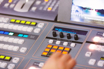 TV editor working at  television broadcast studio desk station