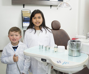 Smiling boy and girl dentist.