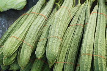 Fototapeta premium Fresh luffa acutangula for cooking in market