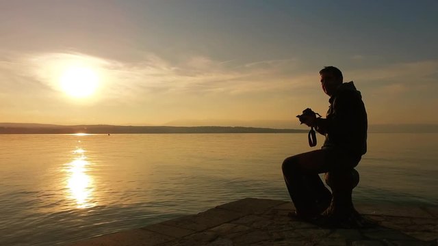 Landscape photographer taking a pictures of the sunset