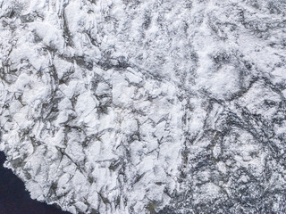 Aerial view of the ice texture broken into pieces of different shapes and sizes 