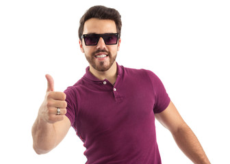 Naklejka premium Man with glasses nods positively. Beautiful and bearded person. He is wearing a magenta polo shirt.
