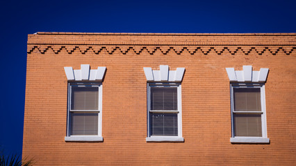 three windows on a  building
