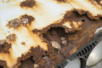 Rusty scrap car's hood