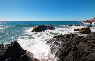 Rocky surf at Cerritos Beach point break between Todos Santos and Cabo San Lucas in Baja California Mexico BCS