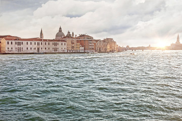 Obraz premium Canal in Venice with boats and old houses in the summer in sunny weather, Italy, Europe