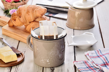Instant freshly brewed cup of coffee on a wooden table