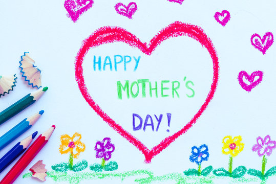 Kid drawing of red heart with HAPPY MOTHER'S DAY text for happy mother's day theme concept.