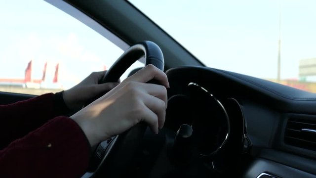 Woman With Steering Wheel Driving In Sunny Day