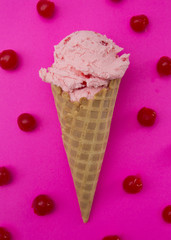 Cherry Ice Cream in a Waffle Cone Surrounded by Cherries