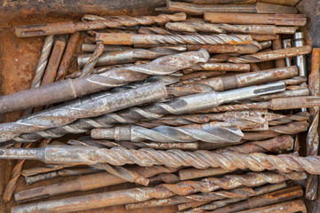 Rusted drills of various sizes