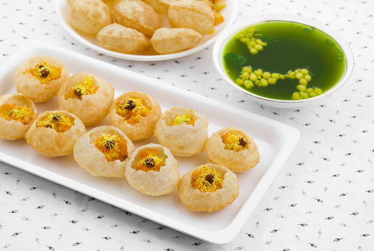 Indian Street Food Pani Puri Also Know as Golgappa or Golgappe is a Common Street Snack From India. It Consists of a Round, Hollow Puri Filled With a Mixture of Flavoured Water And Other Chat Items.