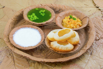Indian Street Food Pani Puri Also Know as Golgappa or Golgappe is a Common Street Snack From India. It Consists of a Round, Hollow Puri Filled With a Mixture of Flavoured Water And Other Chat Items.