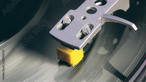 Fototapete Vinyl Player A Fragment Of A Rotating Vinyl Plate A Stylus With Needles Close Up Smoothly Touch The Needle On The Vinyl Plate Close Up Macro Foreground Bright Light Max Larin