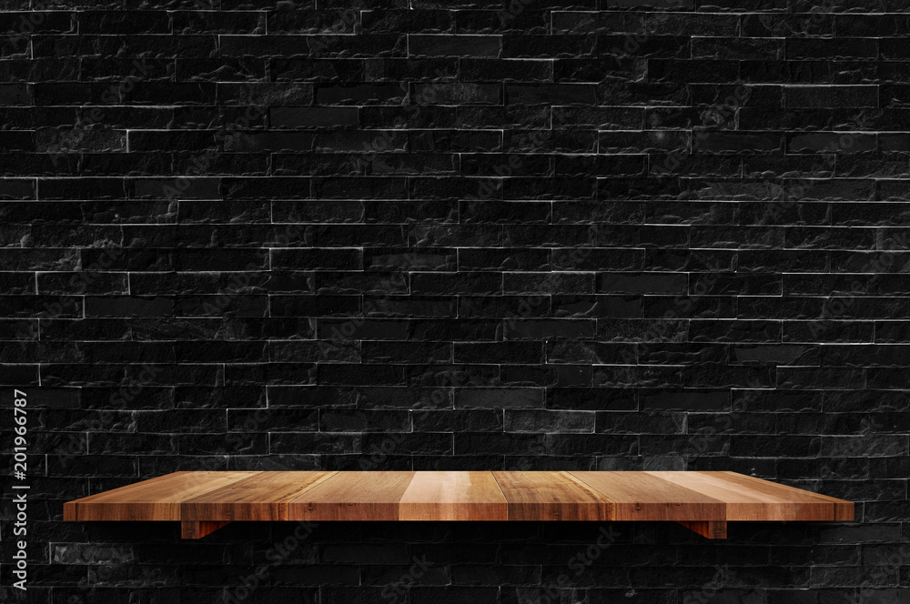 Poster empty wood board shelf at black brick wall background,mock up for display or montage of product or d