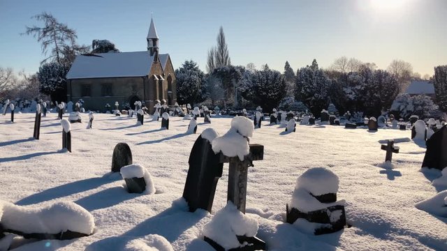 Pretty tombstones and headstones in winter churchyard