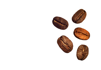 Grains of coffee on white background, close-up.