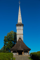 Fototapeta na wymiar Old wooden church in Remetea Chioarului, Romania