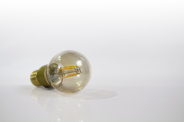 Isolated Incandescent light bulb with white background.