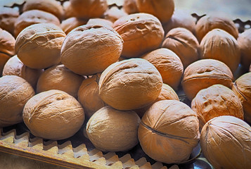 Close-up of walnuts on wooden surface.