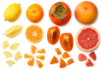 healthy food. mix sliced lemon, persimmon, orange, mandarin and grapefruit with green leaf isolated on white background. top view