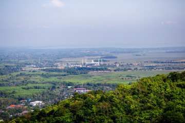 on hill top viewpoint and doing finger frame for crop the sun at sunset time, Hatyai viewpoint, Songkhla, Travel in Thailand, Summer holiday vacation travel trip