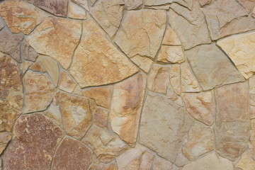 Fototapeta na wymiar Stones wall background texture. Surface natural color