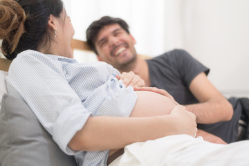 In Selective Focus Of Happy Family Checking New Baby In The Morning.Close Up Of A Beautiful Happy Pregnant Woman With Big Belly. Pregnancy And Motherhood Moment People And Expectation Concept.