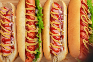 Hot dogs on wooden background