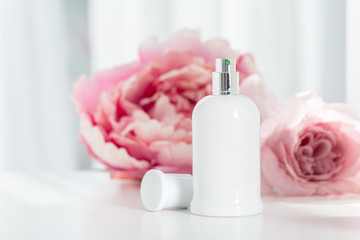 Obraz na płótnie Canvas Perfume bottles with flowers