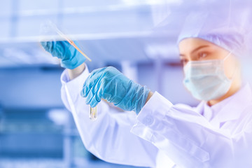 Young female scientist working in laboratory