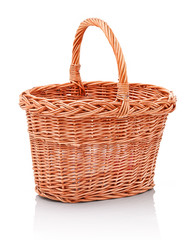 Homemade handmade wicker basket. Isolated on white background with shadow reflection. Empty pannier on white backdrop. Orange skep on white underlay. Domestic handbasket isolated. Prickle