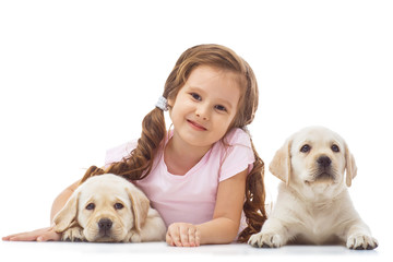 Girl with a labrador puppy, isolated on white