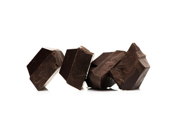Pieces dark chocolate on a white background