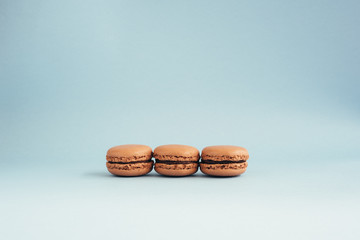 Macarons isolated on blue background