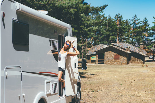Happy girl relaxes on a motor home