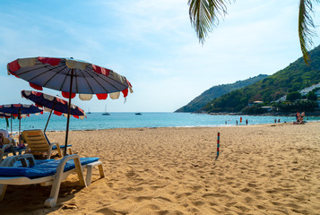 Beautiful umbrella and chair on beach