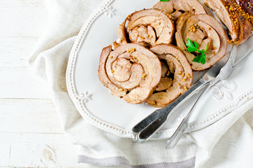 Baked roll from a turkey thigh with a grain mustard
