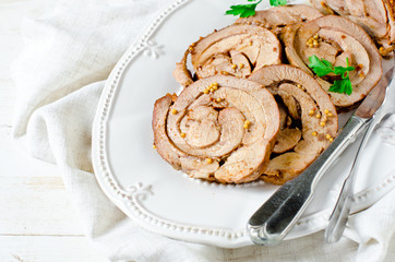 Baked roll from a turkey thigh with a grain mustard