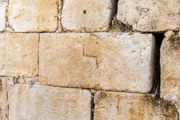 Peleas de Arriba, Spain. Stonemasonry with mason's mark from the ancient former Monastery of Valparaiso used in new houses and walls of the town of Peleas de Arriba