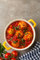 Chicken meatballs with tomato sauce. Served with rice.