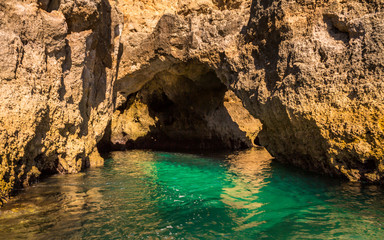 Lagos Caves and Seashore with its Esmerald Water. Exposure done in a boat tour in the Lagos seashore, Algarve, Portugal