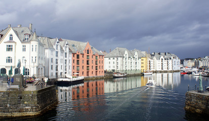 Alesund, Norway - View of colorful buildings in norwegian town before rain, beautiful old city centre